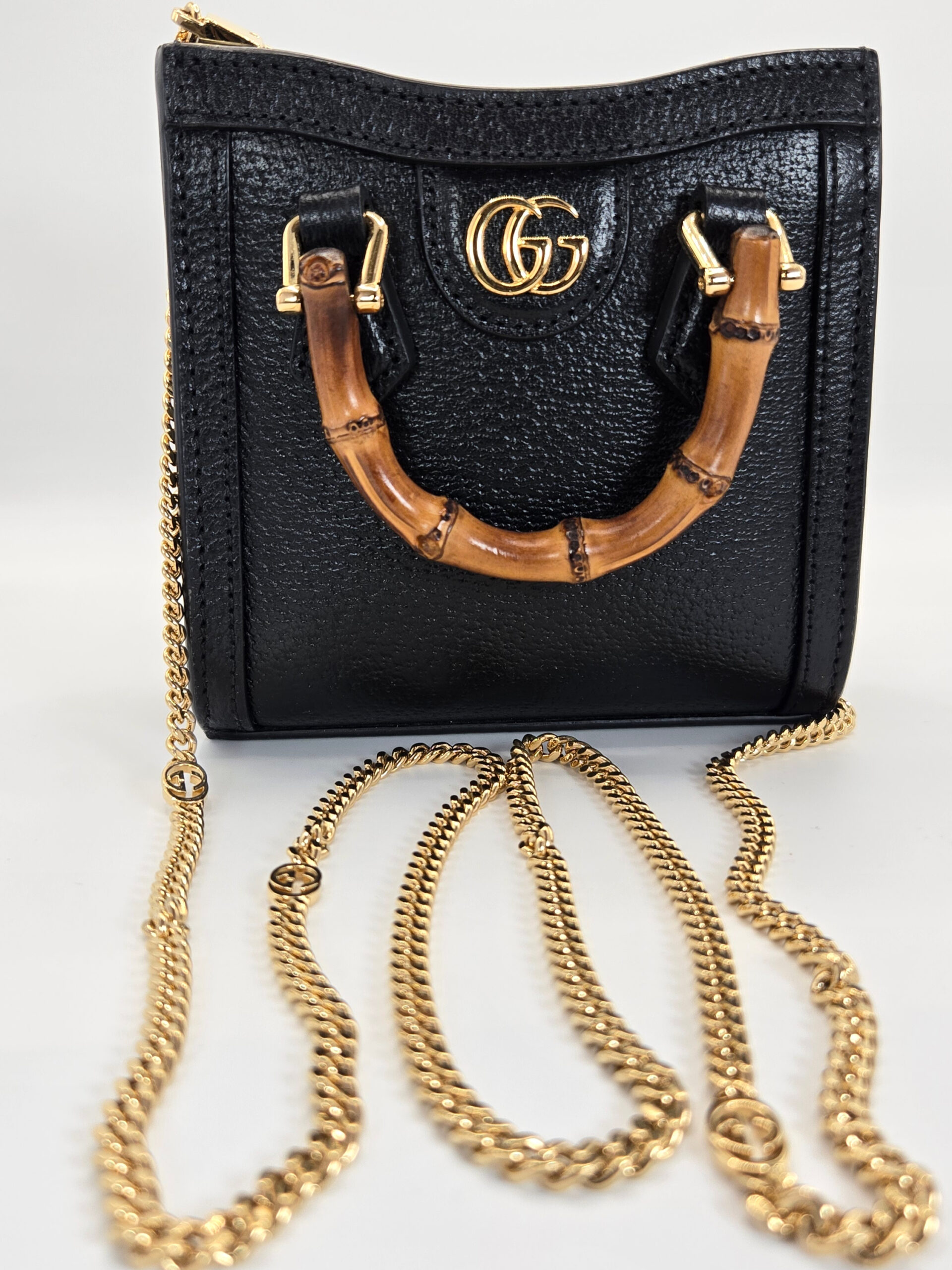 Gucci Diana black mini bag bamboo handle grained leather gold chain strap super mini handbag
