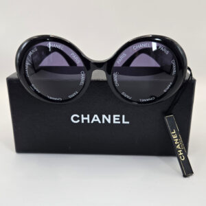 Chanel vintage round sunglasses black with Chanel Paris lettering and gold CC logo arms