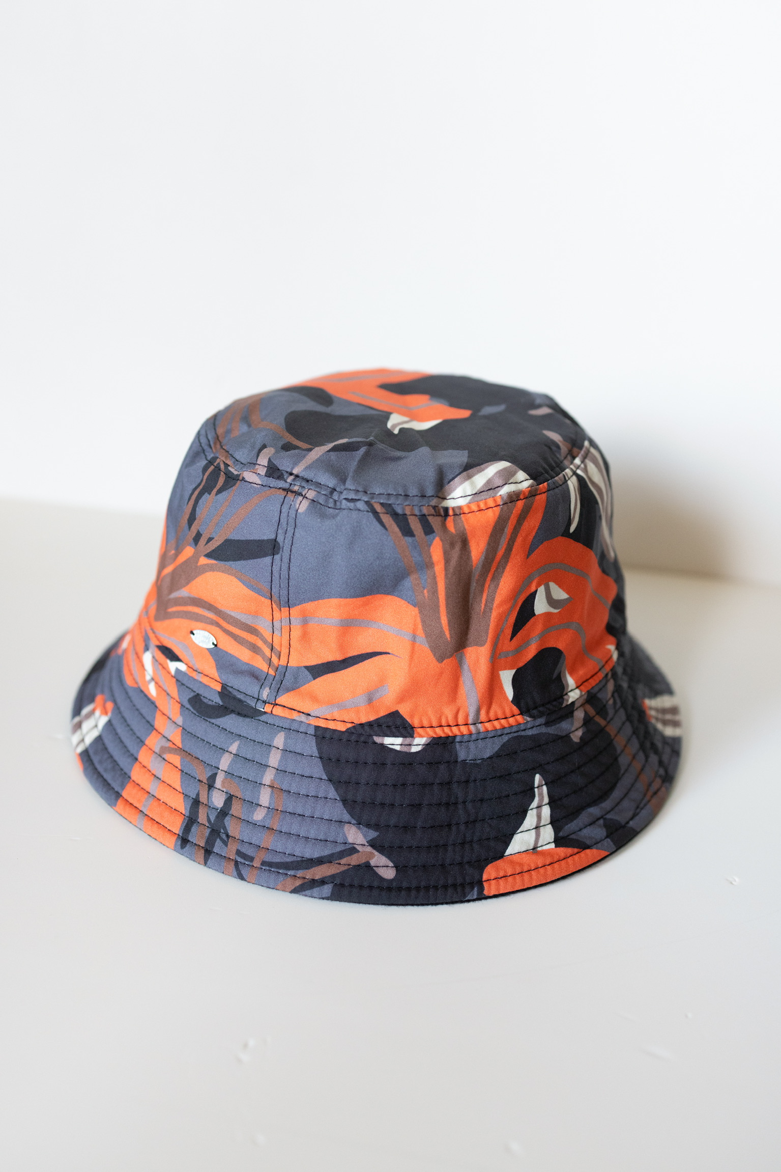 Chanel 23A Reversible Black and Orange Print Bucket Hat – Size M